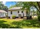 Back of house features steps to back door, A/C unit and manicured landscaping at 1543 Wickham St, Burlington, NC 27215