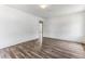 Spacious bedroom with wood-look floors and neutral paint, creating a serene atmosphere at 1543 Wickham St, Burlington, NC 27215
