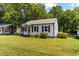 Charming single-story home with well-maintained lawn and curb appeal at 1543 Wickham St, Burlington, NC 27215