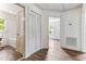 Hallway with a closet, bathroom, and view into the bedroom, all with wood-look flooring at 1543 Wickham St, Burlington, NC 27215