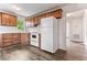 Traditional-style kitchen with white appliances, wood-look flooring, and wooden cabinets at 1543 Wickham St, Burlington, NC 27215