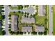 An aerial view showcasing townhomes with landscaped yards, driveways, and organized street layouts in a peaceful setting at 16 Daly Ct, Durham, NC 27705