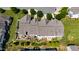 An aerial shot displays the roof and backyards of the townhomes, complete with patios and lush greenery at 16 Daly Ct, Durham, NC 27705