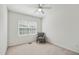 Bright bedroom features a ceiling fan, neutral carpet, and a window for natural light at 16 Daly Ct, Durham, NC 27705