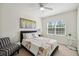 Inviting bedroom with window, fan, and comfortable furniture at 16 Daly Ct, Durham, NC 27705