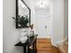 Bright entryway featuring hardwood floors, a decorative console table, and neutral decor at 16 Daly Ct, Durham, NC 27705
