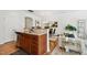 Kitchen and dining area features stainless steel appliances and an island at 16 Daly Ct, Durham, NC 27705