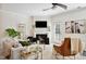 Cozy living room with fireplace, fan, and comfortable seating at 16 Daly Ct, Durham, NC 27705