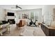 Bright living room with fireplace, fan, and exercise bike at 16 Daly Ct, Durham, NC 27705