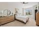This bright main bedroom features a ceiling fan, modern furniture, and natural light from the window at 16 Daly Ct, Durham, NC 27705
