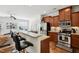 An open floor plan with an eat-in kitchen connecting to the living room with a fireplace at 16 Daly Ct, Durham, NC 27705