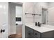 Bathroom with vanity, mirror, quartz countertops, and access to living room at 164 E Spring Showers Trail Trl, Angier, NC 27501