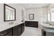A luxurious bathroom features a double vanity, a soaking tub, modern tile floors, and a glass enclosed shower at 164 E Spring Showers Trail Trl, Angier, NC 27501