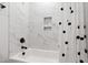 Bathroom features a tile shower with white marble style tiling and black hardware at 164 E Spring Showers Trail Trl, Angier, NC 27501