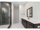 A bathroom featuring a glass shower enclosure, a modern vanity, and dark brown cabinets with contemporary hardware at 164 E Spring Showers Trail Trl, Angier, NC 27501
