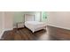 Bedroom with hardwood floors, a nightstand, and a window at 164 E Spring Showers Trail Trl, Angier, NC 27501