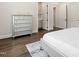 Bedroom featuring a gray dresser, hardwood floors, and natural light at 164 E Spring Showers Trail Trl, Angier, NC 27501