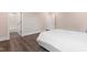Bright bedroom featuring a large bed with white linens and an attached bathroom at 164 E Spring Showers Trail Trl, Angier, NC 27501