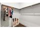Walk-in closet with ample hanging space, wood floors, and a fun piece of art at 164 E Spring Showers Trail Trl, Angier, NC 27501