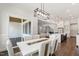 Bright dining area with backyard views and an elegant modern light fixture at 164 E Spring Showers Trail Trl, Angier, NC 27501