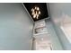 High ceiling foyer with an ornate chandelier and a beautiful blue accent wall at 164 E Spring Showers Trail Trl, Angier, NC 27501