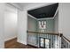 Hallway with black ceiling accent, hardwood floors, and decorative lighting at 164 E Spring Showers Trail Trl, Angier, NC 27501