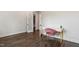 Cozy home office space with dark wood floors, a white desk, and a pink chair at 164 E Spring Showers Trail Trl, Angier, NC 27501