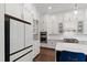 Chef's kitchen boasts stainless steel appliances, marble countertops, and custom cabinets at 164 E Spring Showers Trail Trl, Angier, NC 27501