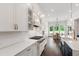 Bright, white eat-in kitchen with state-of-the-art gas range and modern hardware throughout at 164 E Spring Showers Trail Trl, Angier, NC 27501