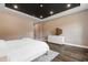 An additional view of the main bedroom boasts hardwood floors, recessed lighting, and a white dresser with an octagonal mirror at 164 E Spring Showers Trail Trl, Angier, NC 27501