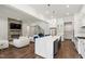 Expansive open concept area featuring kitchen, living, and dining spaces with modern finishes at 164 E Spring Showers Trail Trl, Angier, NC 27501
