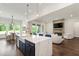 Bright open-concept living space showcases a modern kitchen, living room, and dining area at 164 E Spring Showers Trail Trl, Angier, NC 27501