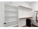 A walk-in closet features built-in shelving, a hanging rod, and ample space for storage with minimalist modern design at 164 E Spring Showers Trail Trl, Angier, NC 27501