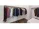 Walk-in closet with ample storage, custom racks and hardwood floors at 164 E Spring Showers Trail Trl, Angier, NC 27501
