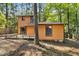 View of backyard featuring a wooden deck perfect for outdoor enjoyment and gatherings at 18 Frances St, Chapel Hill, NC 27517