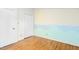 Bright bedroom with mountain mural, hardwood floors, and dual closets at 18 Frances St, Chapel Hill, NC 27517