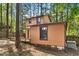 Exterior view of a two-story home surrounded by lush trees at 18 Frances St, Chapel Hill, NC 27517