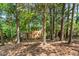 Exterior of the home situated on a wooded lot providing a tranquil and private setting at 18 Frances St, Chapel Hill, NC 27517