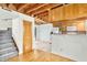 Open-concept kitchen flowing to staircase and living area features bright, eat-in kitchen at 18 Frances St, Chapel Hill, NC 27517