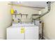 Functional laundry area with washer, dryer, shelving and water heater at 18 Frances St, Chapel Hill, NC 27517