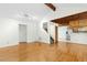 Inviting living room with hardwood floors flows seamlessly into the kitchen at 18 Frances St, Chapel Hill, NC 27517