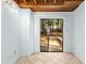 Sliding glass door leading to a bright patio with views of the trees at 18 Frances St, Chapel Hill, NC 27517