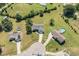Aerial view of homes with driveways, large lots, trees and a swimming pool, showcasing the neighborhood layout at 20 Ingate Way, Louisburg, NC 27549