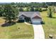 Aerial view of home showcasing its landscaped yard, driveway, and desirable location at 20 Ingate Way, Louisburg, NC 27549