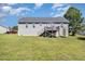 Back exterior view showing deck, siding, and large backyard at 20 Ingate Way, Louisburg, NC 27549