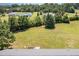 Expansive green backyard with mature trees, offering privacy and space for outdoor activities at 20 Ingate Way, Louisburg, NC 27549