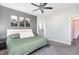 Bright bedroom with a comfortable bed, soft lighting, and serene decor, creating a relaxing retreat at 20 Ingate Way, Louisburg, NC 27549