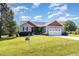 Charming single-story home with a well-manicured lawn and two car garage at 20 Ingate Way, Louisburg, NC 27549
