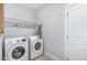 Functional laundry room equipped with Samsung washer and dryer units at 20 Ingate Way, Louisburg, NC 27549