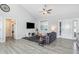 Bright living room featuring a vaulted ceiling and stylish gray flooring at 20 Ingate Way, Louisburg, NC 27549